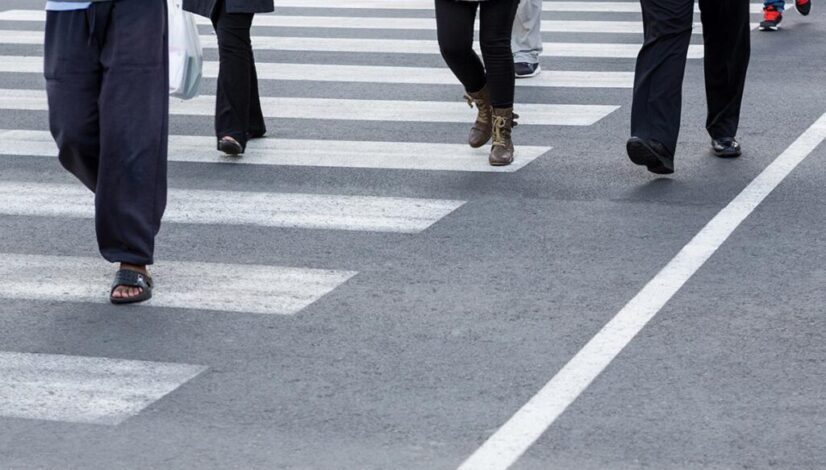 pedestrians crossing construction placeholder